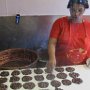 Making the famous American pralines from nuts, sugar, and milk/creame.