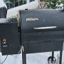 Hopper on left side of smoker is filled with wood pellets and temperature is set to  375-400 degrees.